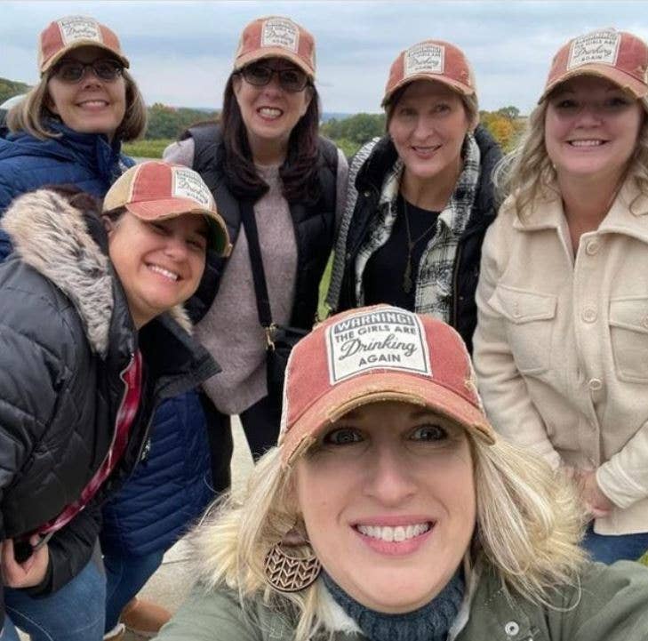 Warning The Girls Are Drinking Again Trucker Baseball Cap